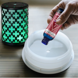 Pouring Cherry Almond Fragrance Oil Inside Diffuser