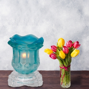 Blue Tulip Light Dimming Oil Warmer Next to Flowers