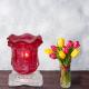 Red Tulip Light Dimming Oil Warmer Next to Flowers